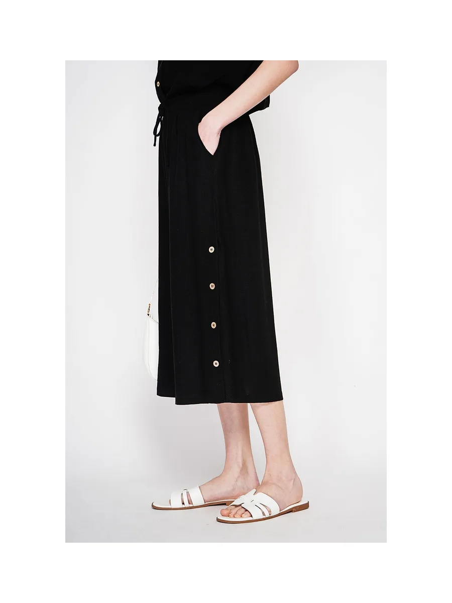 Pantalon coupe jupe poches latérale boutonne sur les cotes 10