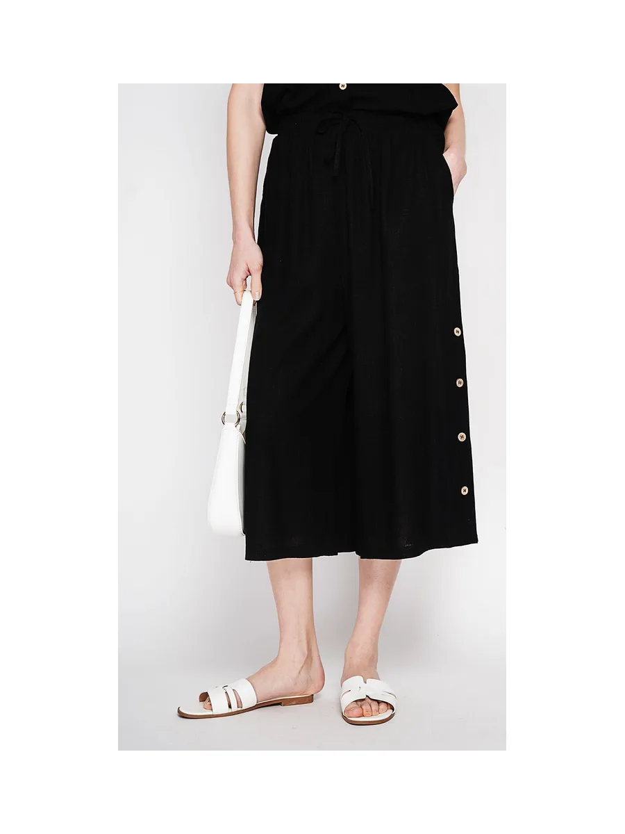 Pantalon coupe jupe poches latérale boutonne sur les cotes 12