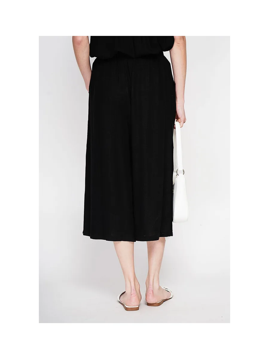Pantalon coupe jupe poches latérale boutonne sur les cotes 11