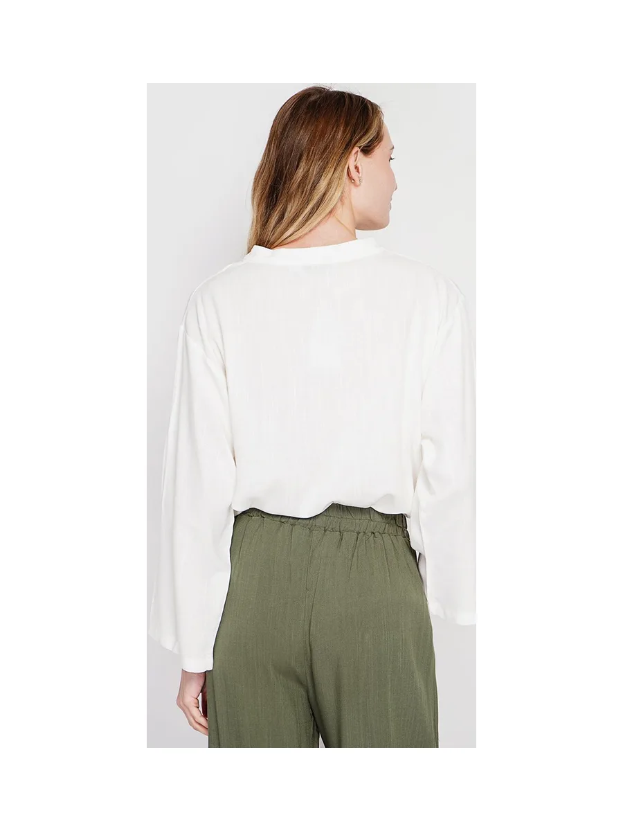 Blouse coupe ample col V en type polo à manches courtes 8